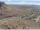 Stunning aerial view of a luxurious neighborhood nestled in the picturesque desert landscape with mountain views at 6106 W Spur Dr, Phoenix, AZ 85083