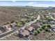 Panoramic aerial view of a peaceful suburban neighborhood nestled amidst the desert landscape with mountain backdrops at 6106 W Spur Dr, Phoenix, AZ 85083