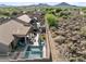 Aerial view of backyard featuring a pool, outdoor kitchen, and patio in a private setting at 6106 W Spur Dr, Phoenix, AZ 85083