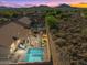 Aerial view of backyard featuring a pool, outdoor kitchen, and patio in a private setting at 6106 W Spur Dr, Phoenix, AZ 85083