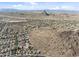 Sprawling aerial view of a well-developed community surrounded by desert landscape and picturesque mountain ranges at 6106 W Spur Dr, Phoenix, AZ 85083