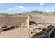 Backyard features a fireplace, a seating area, and a pool, perfect for outdoor entertaining at 6106 W Spur Dr, Phoenix, AZ 85083