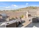 Backyard features a built-in grill, fireplace, a seating area, and a pool, perfect for outdoor living at 6106 W Spur Dr, Phoenix, AZ 85083