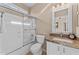 Bathroom featuring a shower over tub with glass door and single sink vanity at 6106 W Spur Dr, Phoenix, AZ 85083