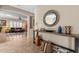 Inviting entryway with tiled floors, console table, and arched entryways leading to the living spaces at 6106 W Spur Dr, Phoenix, AZ 85083