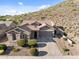 Charming desert home with neutral paint, lush landscaping, and beautiful mountain views at 6106 W Spur Dr, Phoenix, AZ 85083