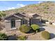Well-maintained single-Gathering home with desert landscaping, attached garage, and stucco facade at 6106 W Spur Dr, Phoenix, AZ 85083