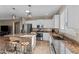 Bright kitchen features white cabinets, granite countertops, stainless steel appliances and central island at 6106 W Spur Dr, Phoenix, AZ 85083
