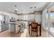 Bright kitchen with granite countertops, an island with seating, and stainless steel appliances at 6106 W Spur Dr, Phoenix, AZ 85083