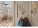 Stylish living room area with neutral colors, tile floors, and a saddle on a stand at 6106 W Spur Dr, Phoenix, AZ 85083