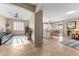 The living room has tile flooring and ceiling fan with open access to the kitchen at 6106 W Spur Dr, Phoenix, AZ 85083