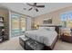 Cozy bedroom features plush carpet, king bed, with sliding doors providing pool access and backyard views at 6106 W Spur Dr, Phoenix, AZ 85083