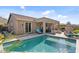 Serene backyard pool with lounge chairs, perfect for outdoor living and relaxation, with a covered patio at 6106 W Spur Dr, Phoenix, AZ 85083