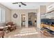 Bright sitting room features tile flooring, desk and views into the bathroom and living room at 6106 W Spur Dr, Phoenix, AZ 85083