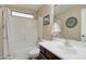 Bathroom featuring a single sink vanity with shower and tub, neutral colors, and good lighting at 708 E Dry Creek Rd, San Tan Valley, AZ 85143