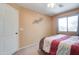 Bedroom featuring a ceiling fan, closet, and plush bedding at 708 E Dry Creek Rd, San Tan Valley, AZ 85143