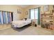 Cozy bedroom with a neutral color scheme, natural light, and simple decor at 708 E Dry Creek Rd, San Tan Valley, AZ 85143