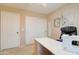 Bedroom featuring built in closet, a sewing machine, and desk with rolling chair at 708 E Dry Creek Rd, San Tan Valley, AZ 85143