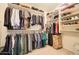 Spacious walk-in closet with ample storage space and custom shelving at 708 E Dry Creek Rd, San Tan Valley, AZ 85143