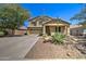 Charming two-story home with desert landscaping and a well-maintained front yard at 708 E Dry Creek Rd, San Tan Valley, AZ 85143