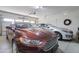 Spacious two car garage with two cars, great for parking and storage at 708 E Dry Creek Rd, San Tan Valley, AZ 85143