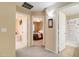 Hallway view with open doorways to bedrooms and a bathroom featuring a walk-in shower at 708 E Dry Creek Rd, San Tan Valley, AZ 85143
