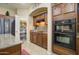 Charming kitchen features granite countertops, stainless steel appliances, a pantry, and an oven at 708 E Dry Creek Rd, San Tan Valley, AZ 85143