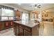 Open kitchen with granite countertops, an island, and a breakfast nook offer great room views at 708 E Dry Creek Rd, San Tan Valley, AZ 85143