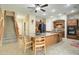 Well-equipped kitchen with a center island, stairs and modern appliances for culinary enthusiasts at 708 E Dry Creek Rd, San Tan Valley, AZ 85143