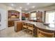 Beautiful kitchen with granite countertops, custom cabinets, and an open layout at 708 E Dry Creek Rd, San Tan Valley, AZ 85143