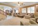 Open-concept living room featuring comfortable seating and a view into the kitchen at 708 E Dry Creek Rd, San Tan Valley, AZ 85143