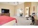 Spacious main bedroom with ensuite bathroom, featuring neutral colors and carpeted floor at 708 E Dry Creek Rd, San Tan Valley, AZ 85143