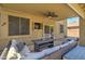 Outdoor patio with comfortable seating, ceiling fan, and TV, great for relaxation and entertainment at 708 E Dry Creek Rd, San Tan Valley, AZ 85143