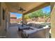 Inviting covered patio featuring outdoor furniture and a ceiling fan perfect for relaxation at 708 E Dry Creek Rd, San Tan Valley, AZ 85143