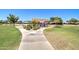Community playground with covered picnic tables, play equipment, and sidewalks on a sunny day at 708 E Dry Creek Rd, San Tan Valley, AZ 85143