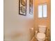 Cozy powder room features a toilet and tile flooring at 708 E Dry Creek Rd, San Tan Valley, AZ 85143