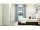 Cozy bedroom with modern decor, accent wall, and lots of natural light at 9532 W Pinchot Ave, Phoenix, AZ 85037