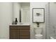 Bright bathroom features a single sink, framed art and shower with curtain at 9552 W Verde Ln, Phoenix, AZ 85037