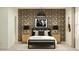 Bedroom featuring graphic wallpaper, hanging guitar and well-appointed nightstands at 9552 W Verde Ln, Phoenix, AZ 85037