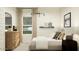 This bedroom is styled with natural light, neutral tones and modern decor at 9552 W Verde Ln, Phoenix, AZ 85037