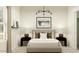 Bedroom featuring neutral tones, framed art, side tables with lamps, and geometric rug at 9552 W Verde Ln, Phoenix, AZ 85037