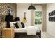 Modern bedroom showcasing patterned wallpaper, dark furniture, and guitar decor at 9552 W Verde Ln, Phoenix, AZ 85037