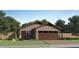 Charming single-story home with a two-car garage, desert landscaping, and neutral color palette at 9552 W Verde Ln, Phoenix, AZ 85037