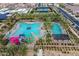 Aerial view of resort-style community pool with slides, lounge areas, and lush landscaping at 9642 E Tesla Ave, Mesa, AZ 85212