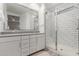 Modern bathroom features double vanity sinks, a spacious walk-in shower with subway tile at 9642 E Tesla Ave, Mesa, AZ 85212