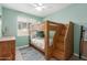 bedroom with bunk beds, a window, and a chest of drawers on a rug at 9642 E Tesla Ave, Mesa, AZ 85212