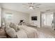 Inviting bedroom featuring a ceiling fan, a desk, and a tv for relaxation at 9642 E Tesla Ave, Mesa, AZ 85212