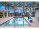 Inviting community pool with poolside seating, a lift for accessibility, and shaded cabanas at 9642 E Tesla Ave, Mesa, AZ 85212