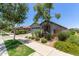 Charming single-story home featuring a two car garage and desert landscaping in the front yard at 9642 E Tesla Ave, Mesa, AZ 85212