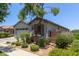 Charming single-story home featuring a two car garage and desert landscaping in the front yard at 9642 E Tesla Ave, Mesa, AZ 85212